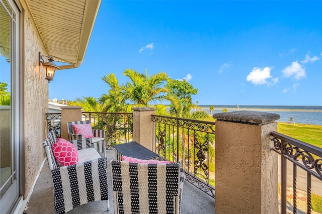 balcony featuring a water view