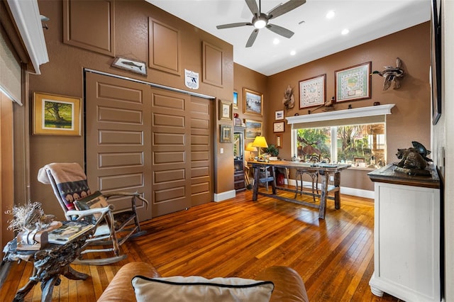 home office featuring ceiling fan and dark hardwood / wood-style flooring