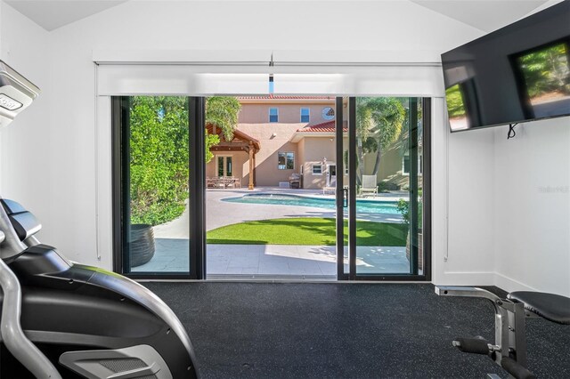 doorway featuring lofted ceiling