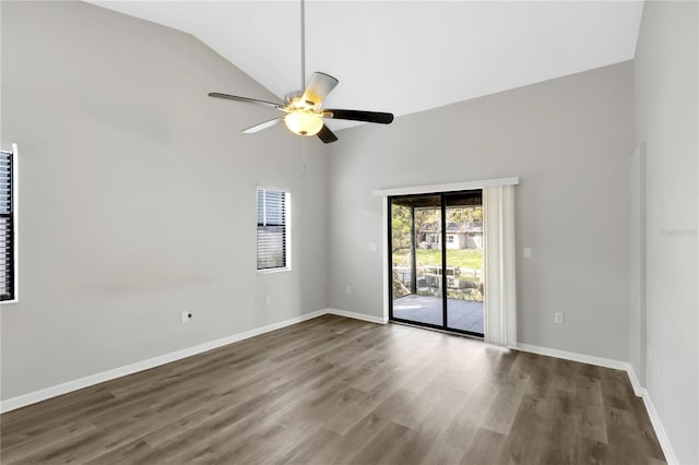 spare room featuring wood-type flooring, high vaulted ceiling, and ceiling fan