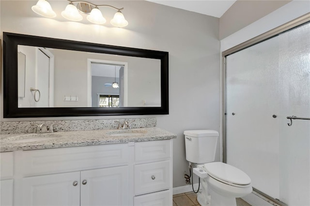 bathroom with vanity, toilet, and tile patterned flooring