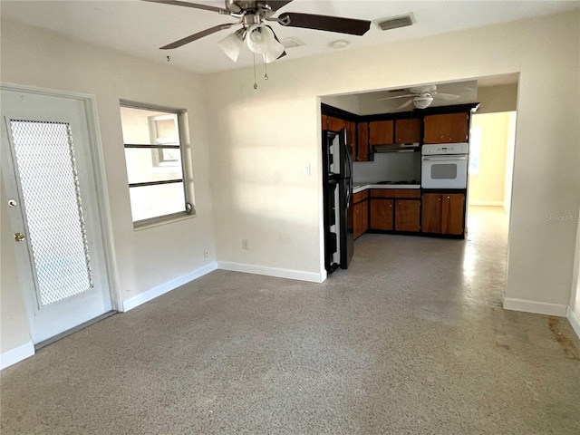 unfurnished living room with ceiling fan