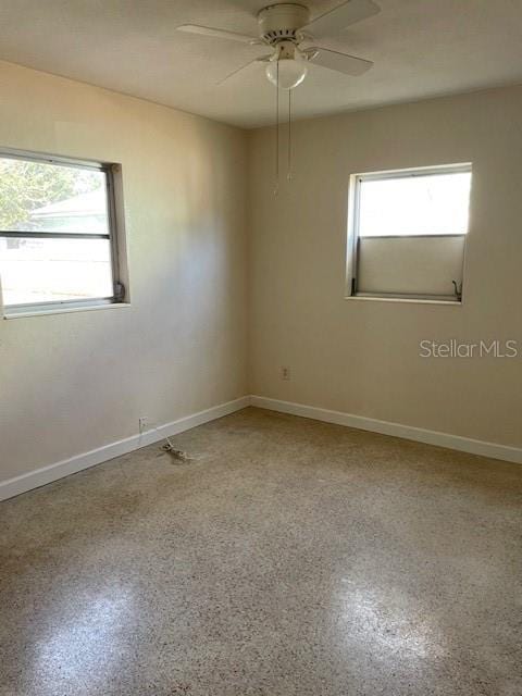 spare room with ceiling fan