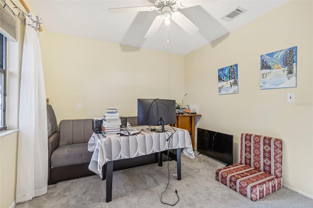 home office featuring carpet flooring and ceiling fan