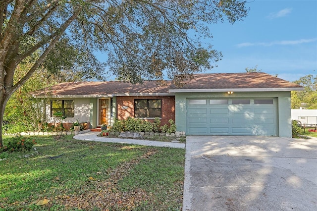 ranch-style home featuring a front yard and a garage