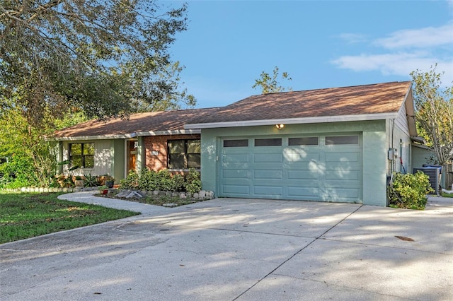 ranch-style home featuring a garage