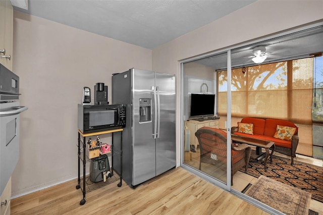 kitchen with light wood-type flooring and stainless steel appliances