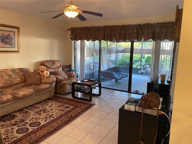 5105 Garden Vale Ave, Tampa, FL 33624 - living area with light tile patterned floors and a ceiling fan