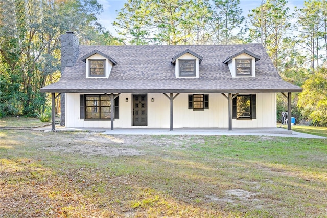 view of front of property featuring a porch and a front lawn