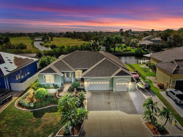 view of front of house featuring a water view and a garage