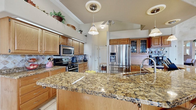 kitchen with a large island, sink, tasteful backsplash, pendant lighting, and appliances with stainless steel finishes