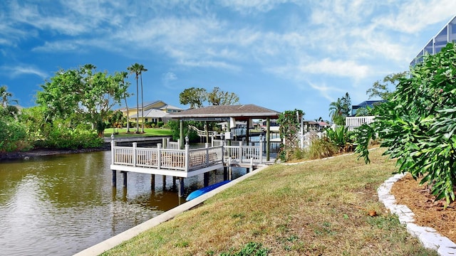 view of dock featuring a yard and a water view