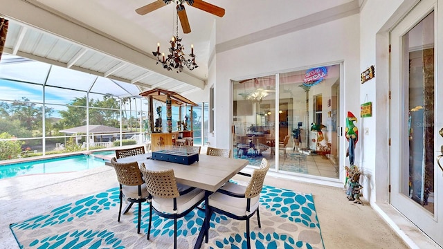 sunroom with vaulted ceiling with beams, ceiling fan, and a swimming pool