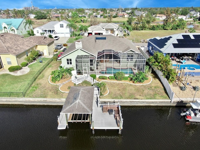 birds eye view of property with a water view