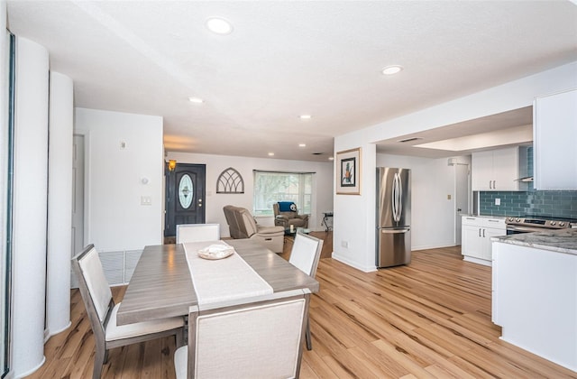 dining room with light wood-type flooring