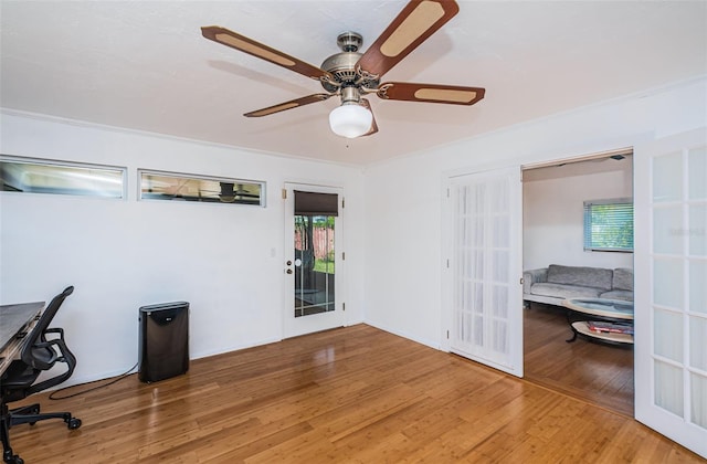 office space featuring hardwood / wood-style floors, ornamental molding, and french doors