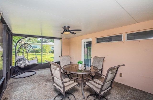 sunroom / solarium featuring ceiling fan