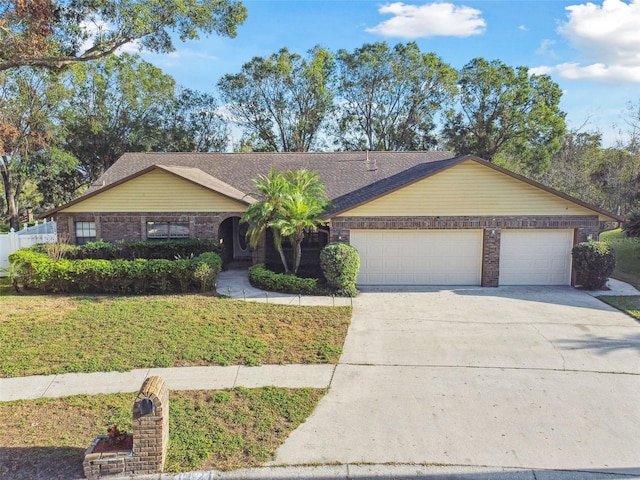 single story home featuring a garage