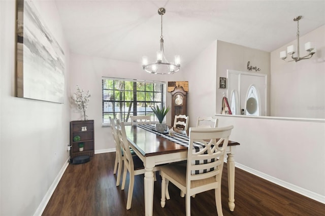 dining area featuring dark hardwood / wood-style flooring and a chandelier