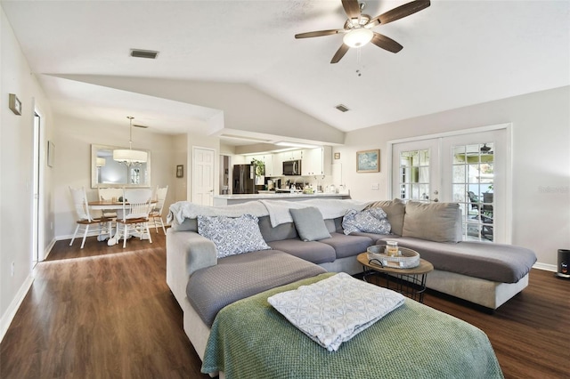 living room with french doors, dark hardwood / wood-style floors, ceiling fan, and lofted ceiling