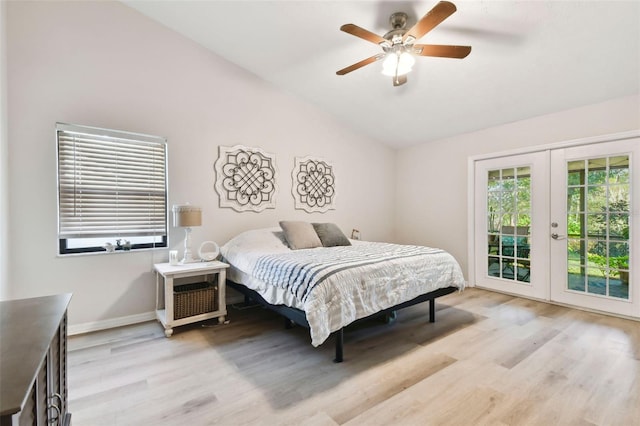 bedroom with access to exterior, french doors, ceiling fan, light hardwood / wood-style floors, and lofted ceiling