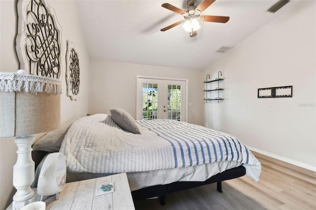 bedroom featuring access to exterior, french doors, vaulted ceiling, ceiling fan, and hardwood / wood-style flooring