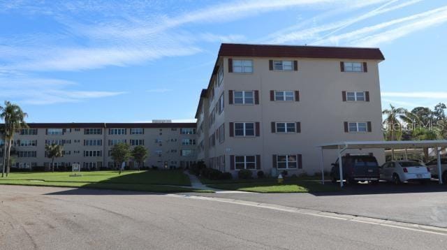 view of building exterior featuring a carport