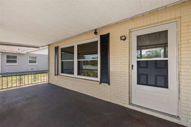 doorway to property with a porch