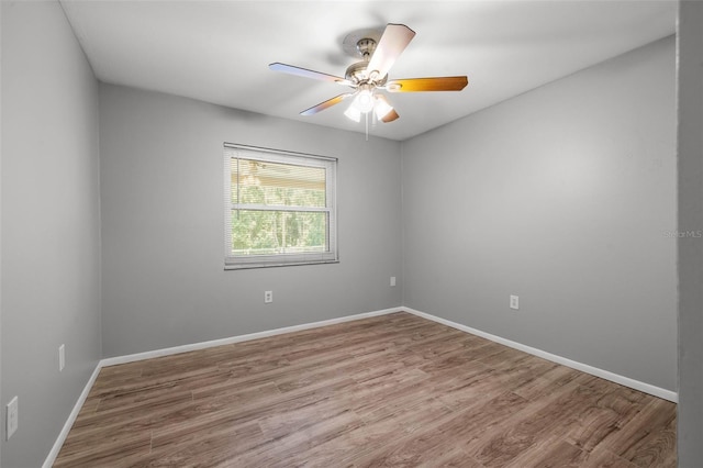 empty room featuring hardwood / wood-style floors and ceiling fan