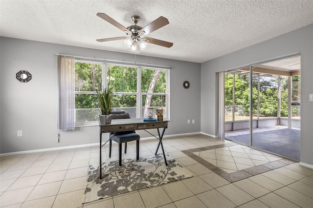 office area featuring light tile patterned floors, a textured ceiling, and ceiling fan