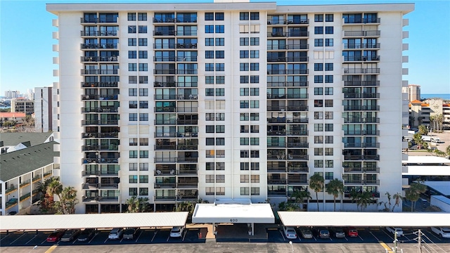 400 Island Way Unit 1411, Clearwater Beach, FL 33767 - view of apartment building / complex featuring uncovered parking