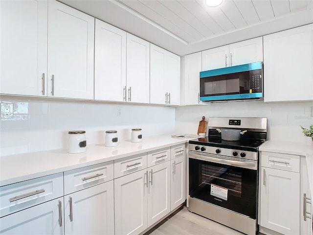 kitchen with stainless steel appliances and white cabinetry