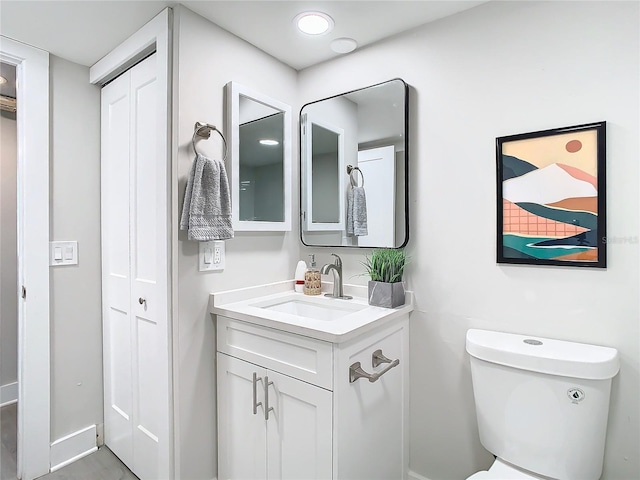 400 Island Way Unit 1411, Clearwater Beach, FL 33767 - bathroom with vanity, toilet, and baseboards