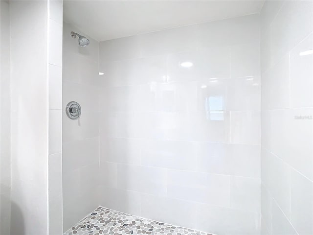 bathroom with a tile shower