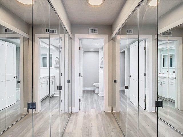 hall featuring light wood-type flooring