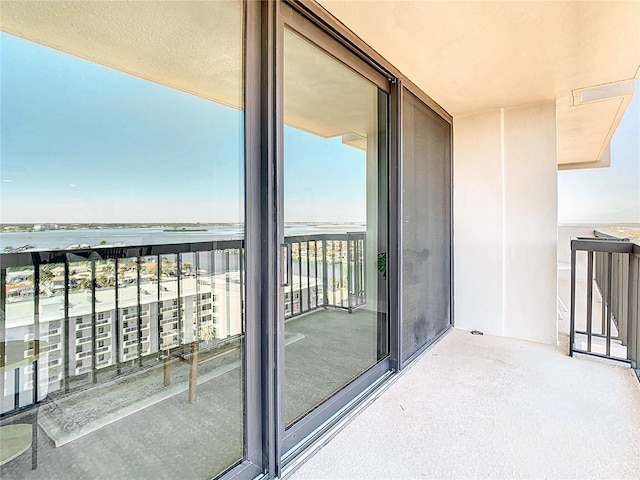 balcony featuring a water view