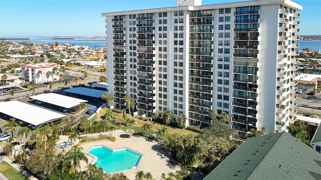 400 Island Way Unit 1411, Clearwater Beach, FL 33767 - view of apartment building / complex featuring a water view and a community pool