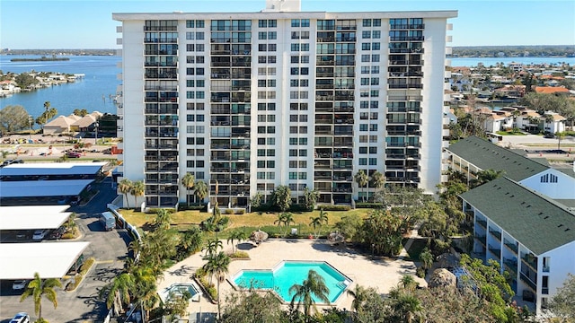 400 Island Way Unit 1411, Clearwater Beach, FL 33767 - view of apartment building / complex with a water view and a community pool