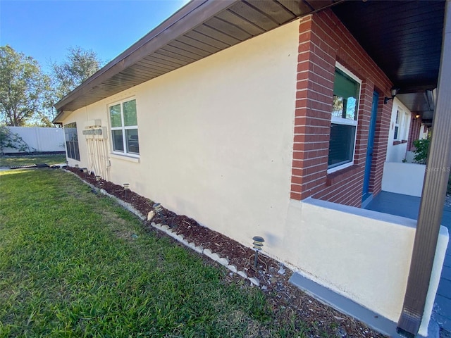 view of home's exterior with a yard