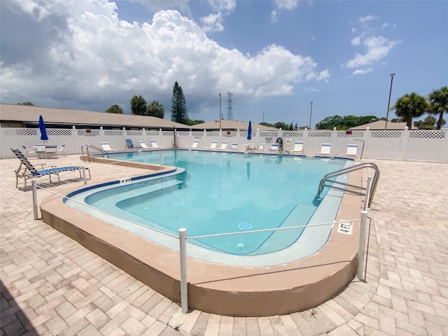 view of pool featuring a patio area