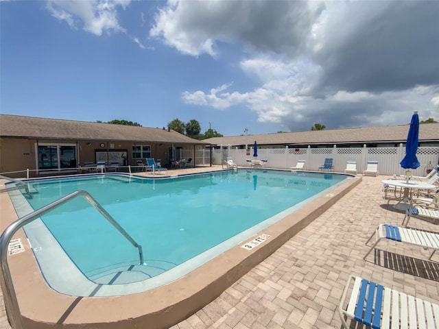 view of pool featuring a patio area