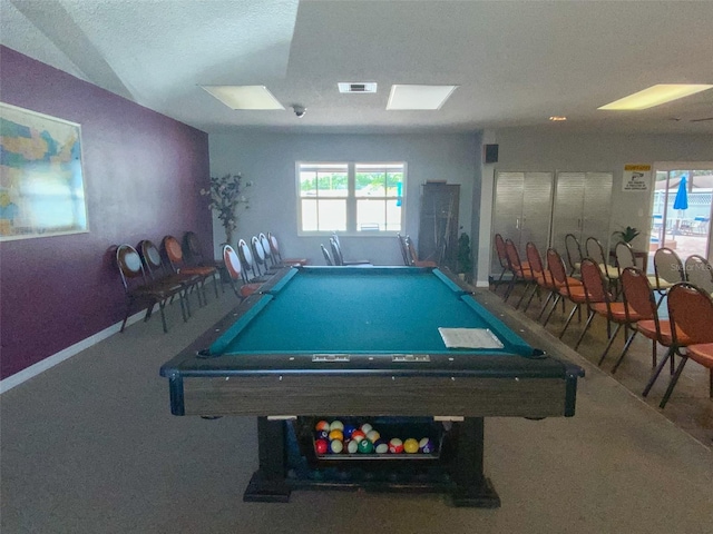 game room featuring pool table and a textured ceiling