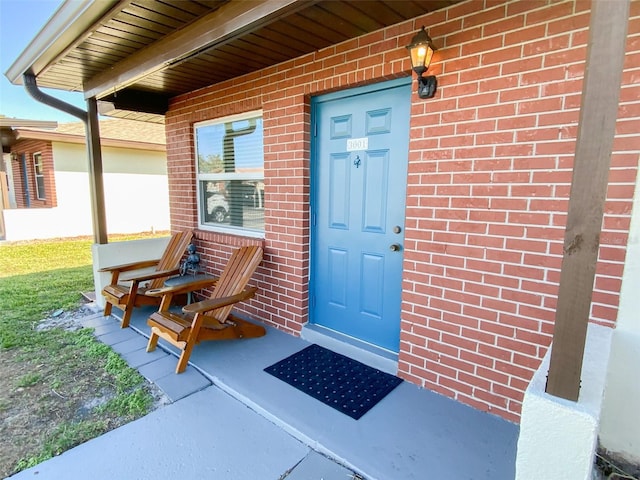 doorway to property with a porch