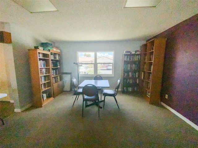 unfurnished dining area featuring carpet flooring