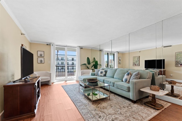 201 W Laurel St Unit 503, Tampa, FL 33602 - living area featuring light wood-style floors and crown molding