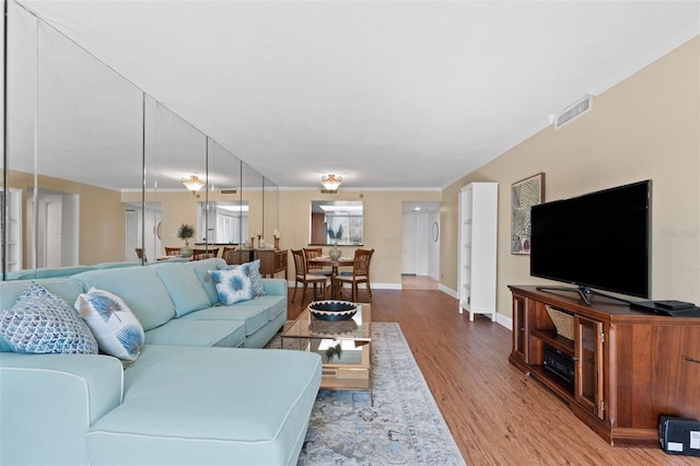 201 W Laurel St Unit 503, Tampa, FL 33602 - living room featuring wood finished floors, baseboards, and ornamental molding