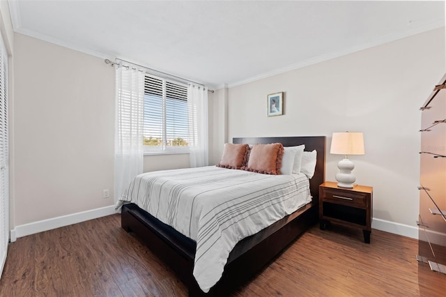 201 W Laurel St Unit 503, Tampa, FL 33602 - bedroom with crown molding, baseboards, and wood finished floors