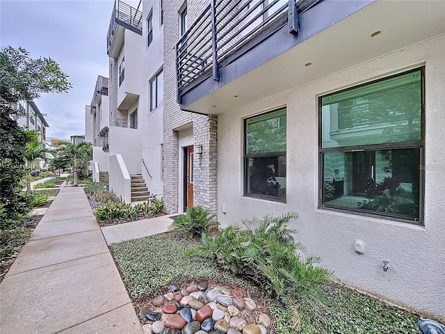 2511 N Grady Ave N Unit 59, Tampa, FL 33607 - view of property exterior featuring brick siding and stucco siding