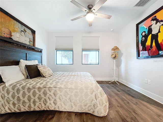 bedroom featuring ceiling fan and dark hardwood / wood-style flooring