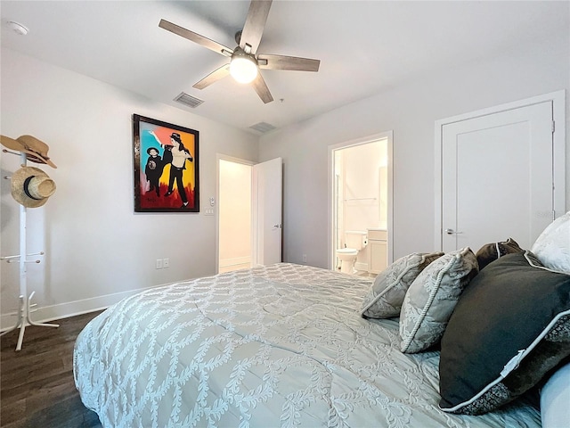 bedroom with ensuite bath, ceiling fan, and dark wood-type flooring